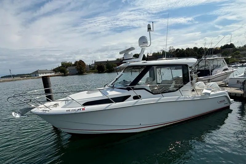 Yacht Photos Pics 2020 Boston Whaler 325 Conquest Pilothouse boat docked in a marina.