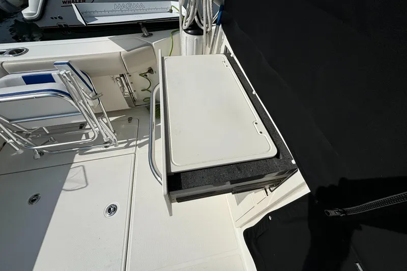  Yacht Photos Pics 2020 Boston Whaler 325 Conquest Pilothouse deck with foldable table and seating.
