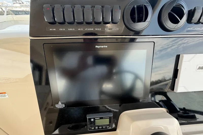  Yacht Photos Pics Control panel of 2020 Boston Whaler 325 Conquest Pilothouse with Raymarine display.