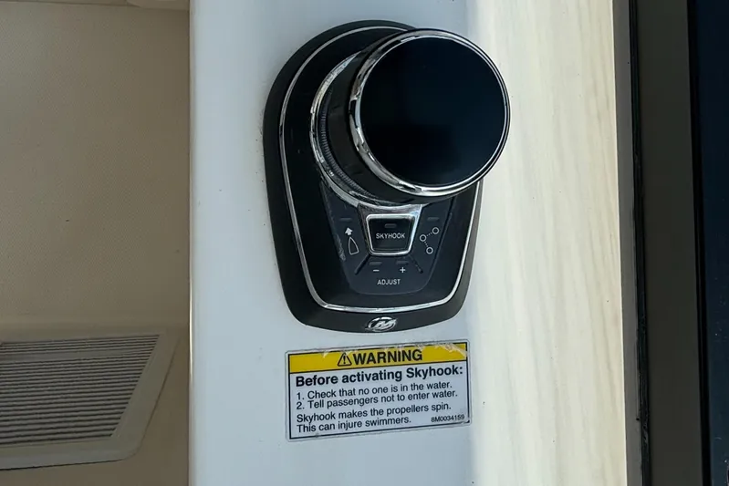  Yacht Photos Pics Control panel on 2020 Boston Whaler 325 Conquest Pilothouse with Skyhook warning label.