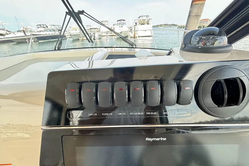  Yacht Photos Pics Control panel of 2020 Boston Whaler 325 Conquest Pilothouse with Raymarine display.