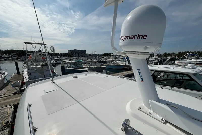  Yacht Photos Pics 2020 Boston Whaler 325 Conquest Pilothouse docked, featuring Raymarine equipment.