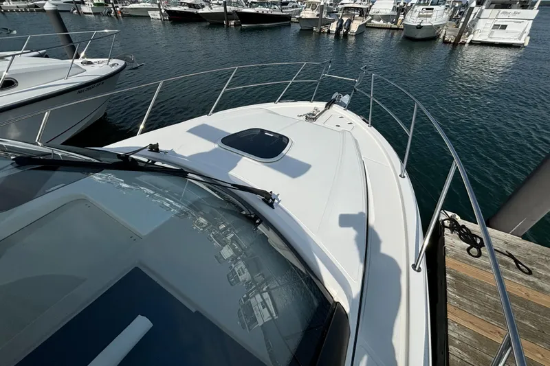  Yacht Photos Pics 2020 Boston Whaler 325 Conquest Pilothouse docked at marina, top view.