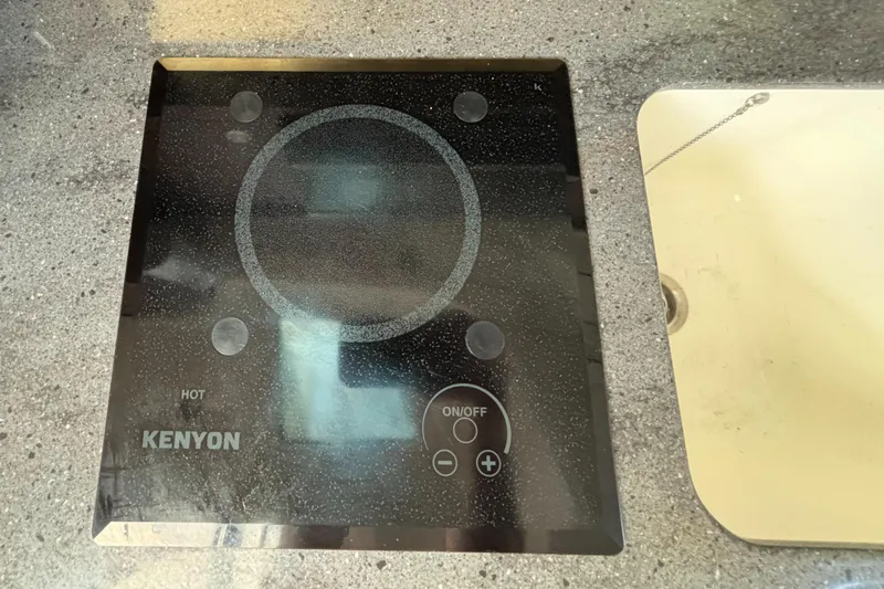  Yacht Photos Pics Kenyon cooktop on 2020 Boston Whaler 325 Conquest Pilothouse kitchen counter.