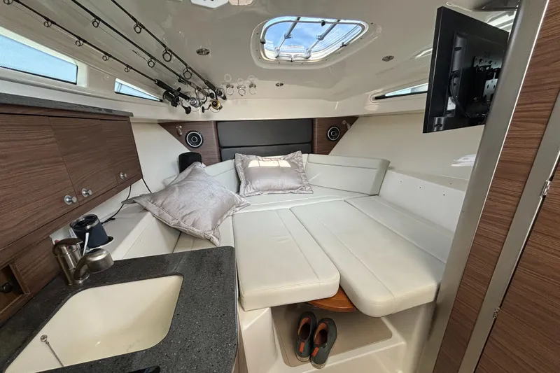  Yacht Photos Pics Interior of 2020 Boston Whaler 325 Conquest Pilothouse with cozy seating and modern amenities.