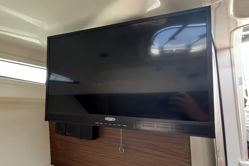  Yacht Photos Pics Flat-screen TV inside 2020 Boston Whaler 325 Conquest Pilothouse boat cabin.