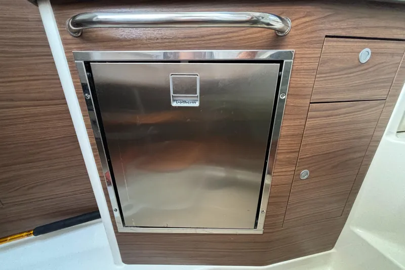  Yacht Photos Pics Stainless steel appliance on 2020 Boston Whaler 325 Conquest Pilothouse with wood paneling.