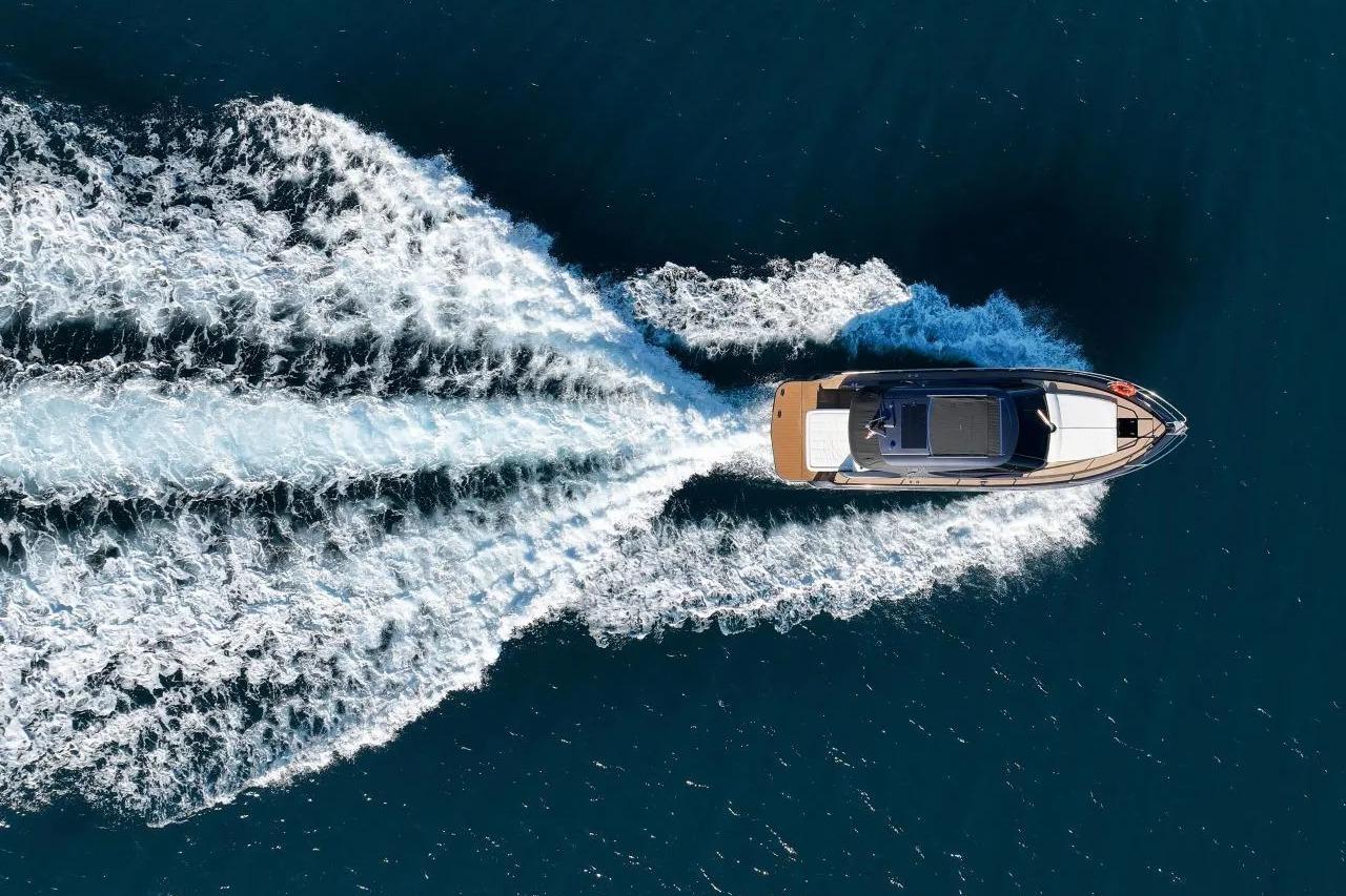 Aerial view of 2023 Focus Power 36 yacht cruising on open water.