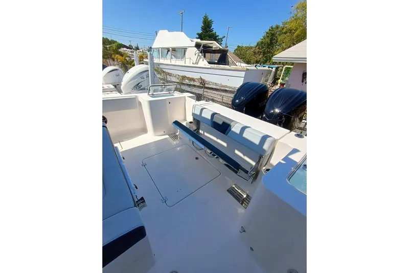 300-115 Yacht Photos Pics 2025 Robalo 300 boat interior with seating and dual outboard engines.