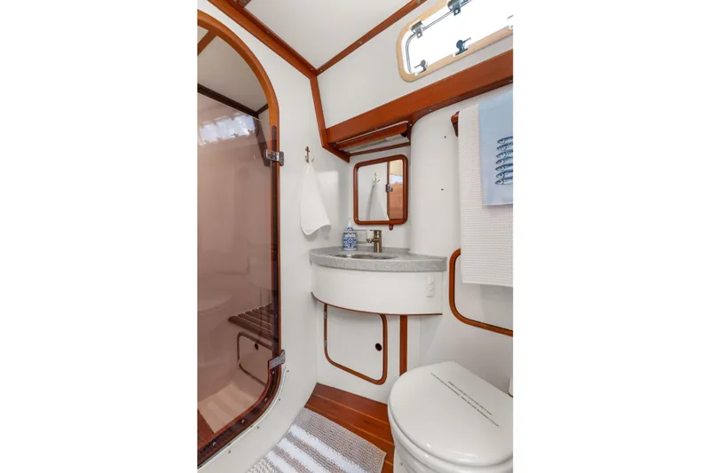 Callahan Yacht Photos Pics Bathroom interior of 2000 Ta Shing Taswell 44 All Season yacht, featuring sink and shower.