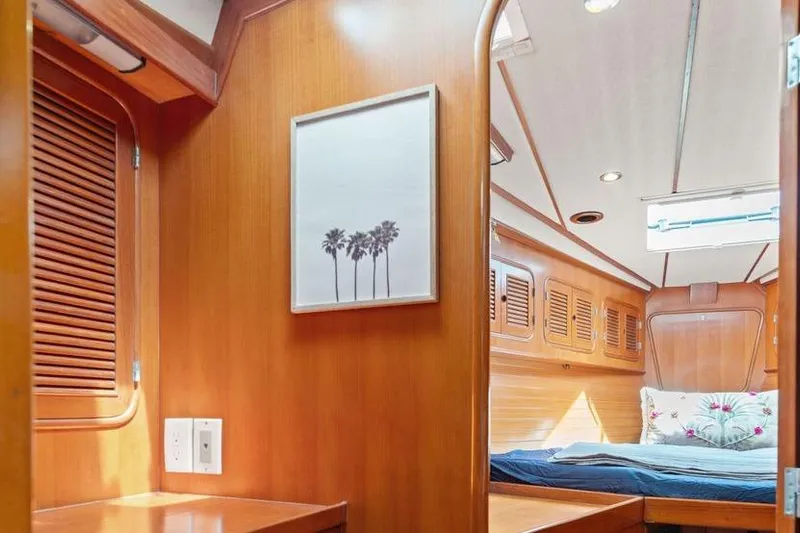 Callahan Yacht Photos Pics Interior of 2000 Ta Shing Taswell 44 All Season yacht with wood paneling and cozy bedroom.