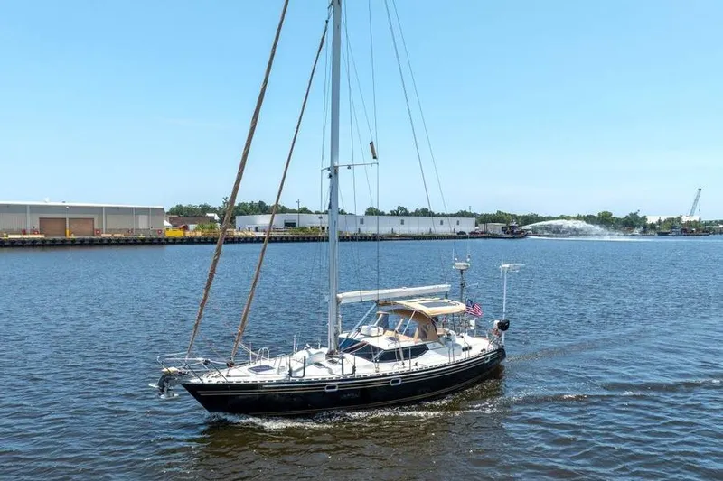 Callahan Yacht Photos Pics Sailboat on water, 2000 Ta Shing Taswell 44 All Season, sunny day, industrial background.