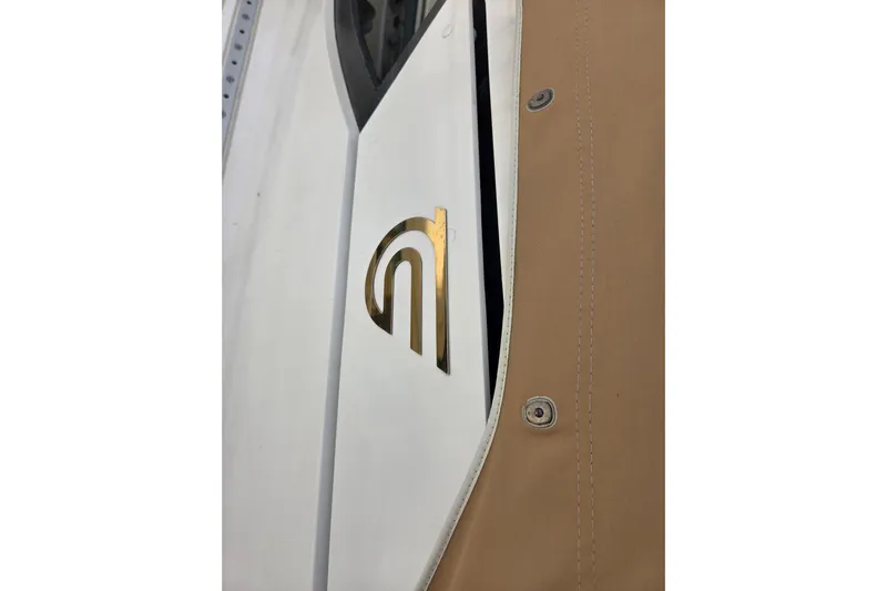 Callahan Yacht Photos Pics Close-up of 2000 Ta Shing Taswell 44 All Season yacht logo and beige cover.