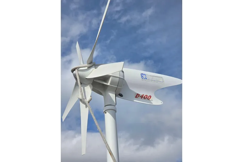 Callahan Yacht Photos Pics Wind turbine on a Ta Shing Taswell 44 All Season yacht, 2000 model, against cloudy sky.