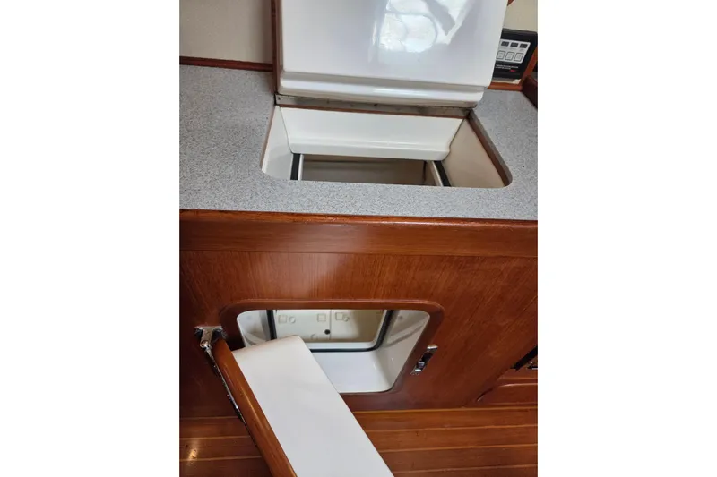 Callahan Yacht Photos Pics Interior view of 2000 Ta Shing Taswell 44 All Season yacht, featuring wooden cabinetry and storage compartments.