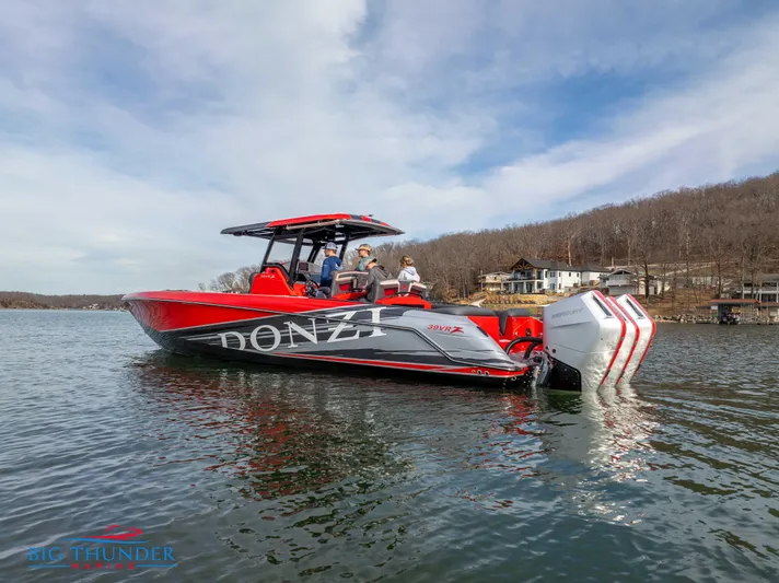  Yacht Photos Pics 2024 Donzi 39 VRZ boat on a lake with people onboard.
