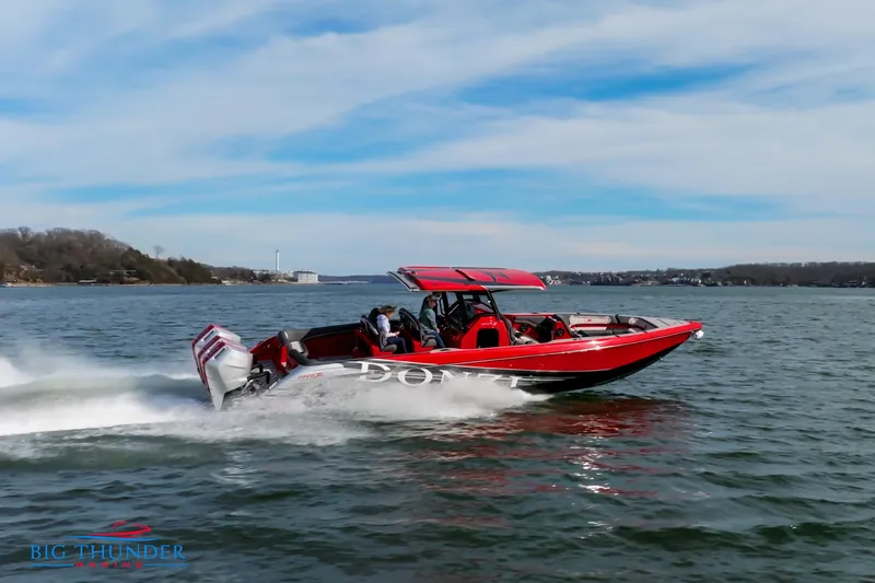  Yacht Photos Pics 2024 Donzi 39 VRZ speedboat cruising on a lake.