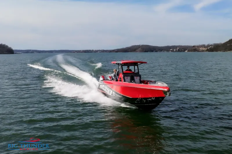  Yacht Photos Pics 2024 Donzi 39 VRZ speedboat cruising on a lake.