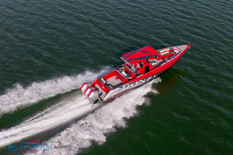  Yacht Photos Pics 2024 Donzi 39 VRZ speedboat cruising on open water.