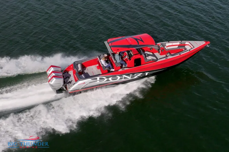 Yacht Photos Pics 2024 Donzi 39 VRZ speedboat cruising on water.