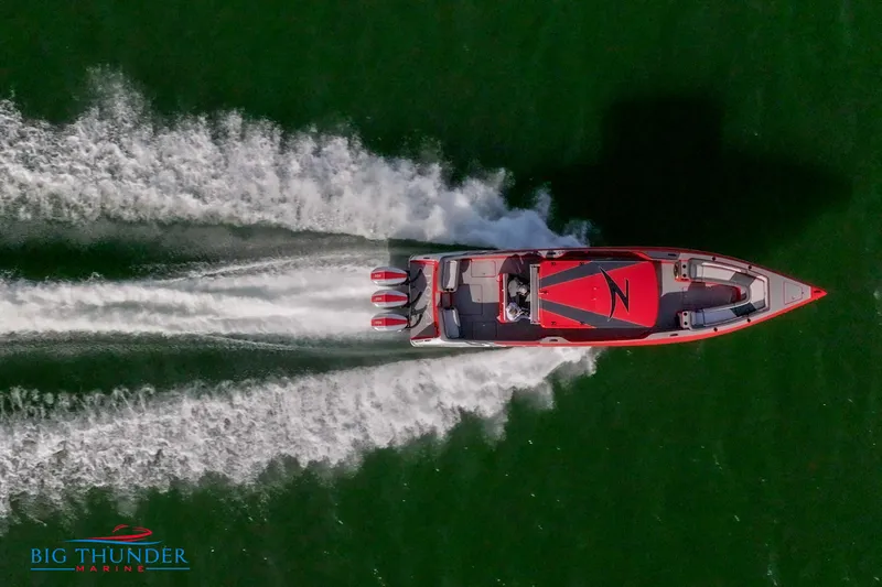  Yacht Photos Pics Aerial view of 2024 Donzi 39 VRZ speedboat on water.
