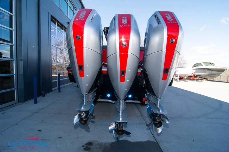  Yacht Photos Pics 2024 Donzi 39 VRZ with triple outboard engines at a marina.