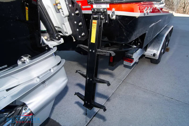  Yacht Photos Pics 2024 Donzi 39 VRZ boat on trailer, rear view showing outboard motor and ladder.