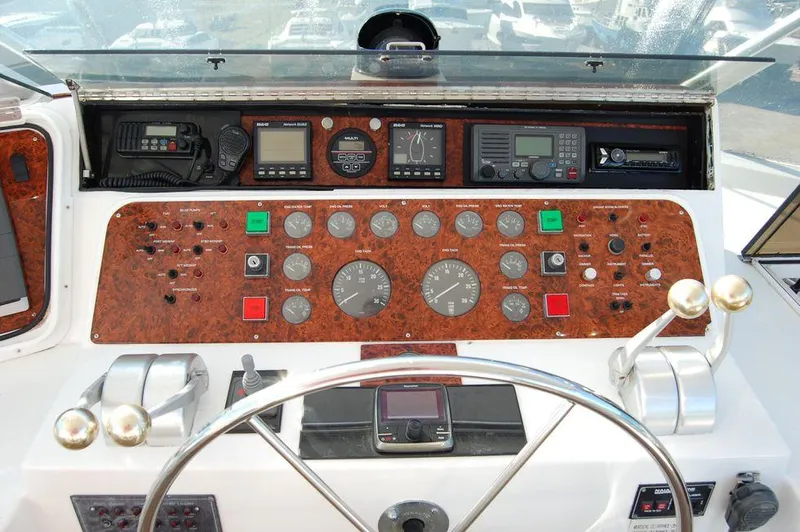  Yacht Photos Pics Control panel of a 1990 Hatteras 78 Aft Cockpit Motoryacht with navigation instruments.