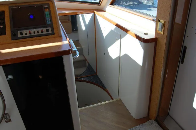  Yacht Photos Pics Interior of 1990 Hatteras 78 Aft Cockpit Motoryacht with stairs and control panel.