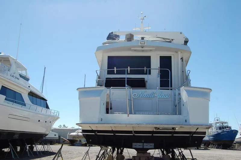  Yacht Photos Pics 1990 Hatteras 78 Aft Cockpit Motoryacht on dry dock, rear view.
