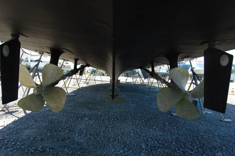  Yacht Photos Pics Underside view of 1990 Hatteras 78 Aft Cockpit Motoryacht with propellers.