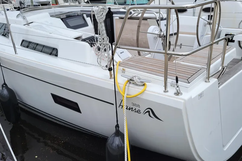  Yacht Photos Pics 2024 Hanse 388 sailboat docked, featuring sleek design and modern amenities.