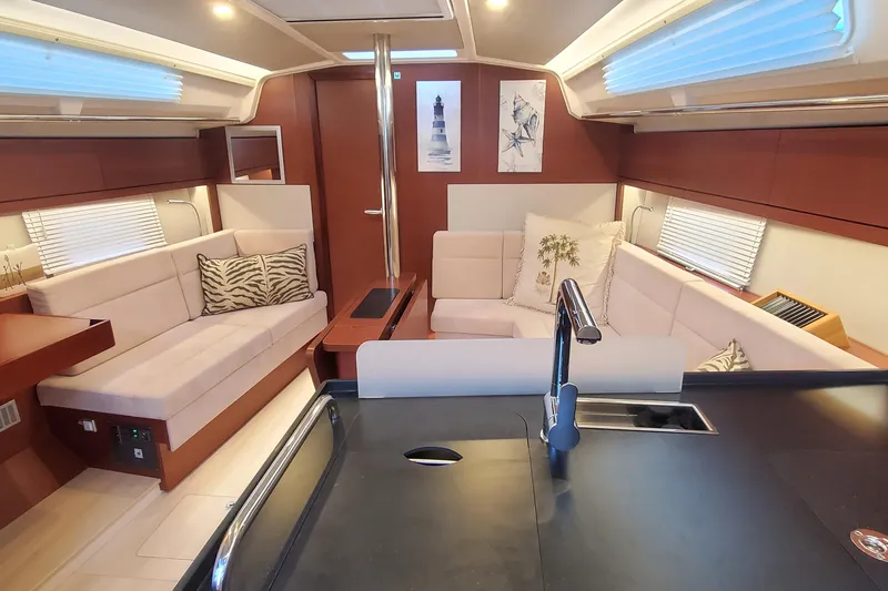  Yacht Photos Pics Luxurious interior of 2024 Hanse 388 yacht with modern seating and elegant decor.
