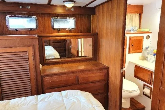 Bedouin Yacht Photos Pics 1998 DeFever 44 Sundeck Trawler interior with wood paneling and cozy cabin amenities.