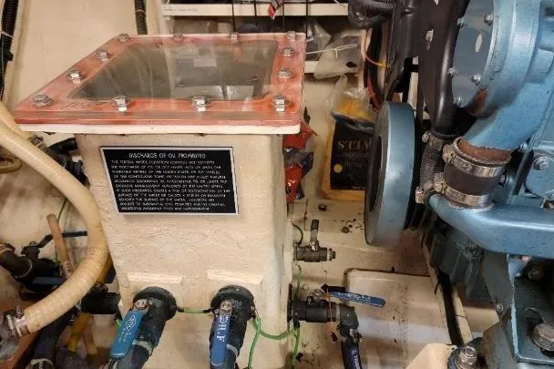 Bedouin Yacht Photos Pics Engine room of 1998 DeFever 44 Sundeck Trawler with visible machinery and components.