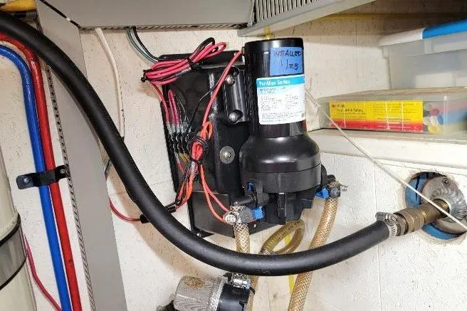 Bedouin Yacht Photos Pics Engine room of 1998 DeFever 44 Sundeck Trawler with installed water pump system.