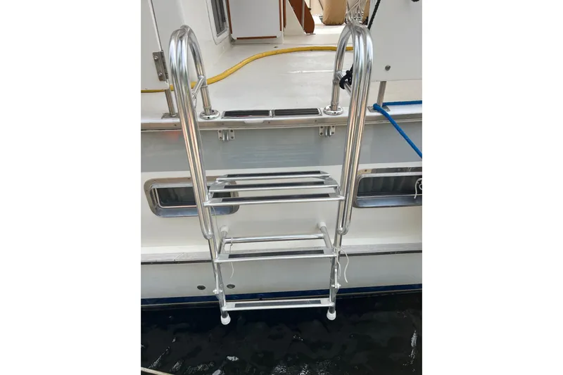 Bedouin Yacht Photos Pics Stainless steel ladder on 1998 DeFever 44 Sundeck Trawler yacht.