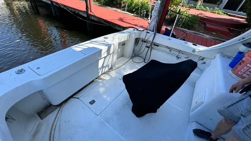 Just For Kicks Yacht Photos Pics Luhrs 36 Convertible 2000 boat deck with covered equipment, dockside view.