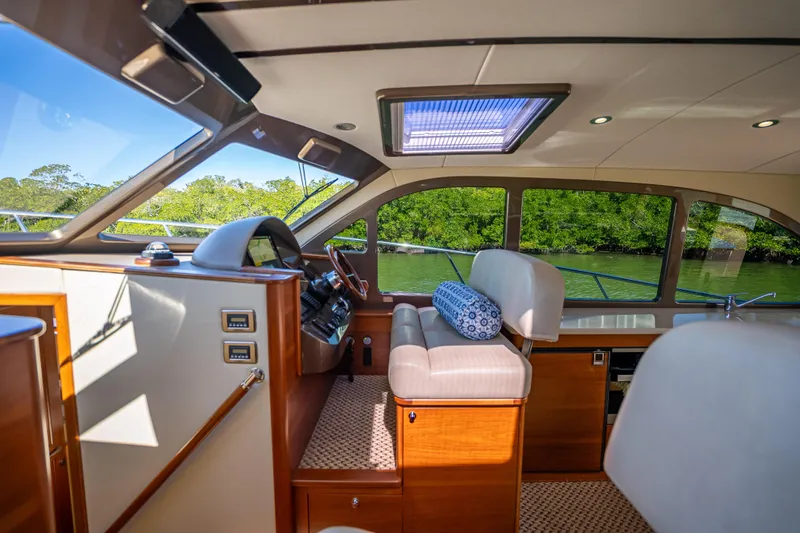 Miller Time Yacht Photos Pics Luxurious interior of 2017 Palm Beach Motor Yachts PB45 with plush seating and scenic views.