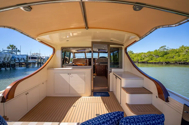 Miller Time Yacht Photos Pics 2017 Palm Beach Motor Yachts PB45 interior with elegant wood finish and spacious seating area.