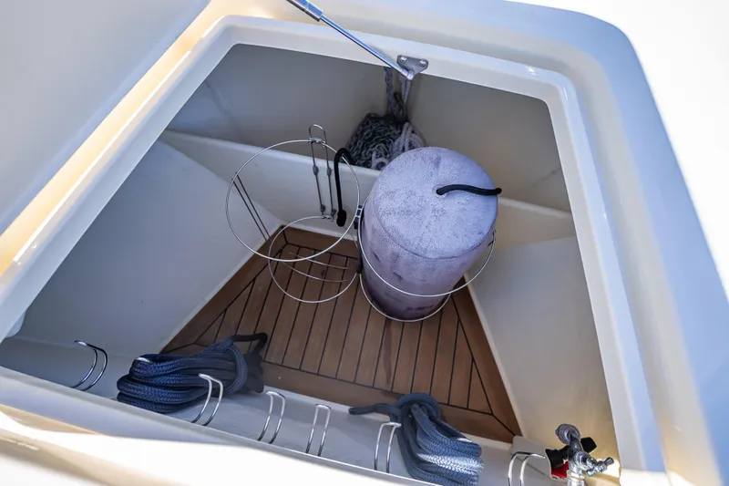 Miller Time Yacht Photos Pics Storage compartment on 2017 Palm Beach Motor Yachts PB45 with ropes and fender.