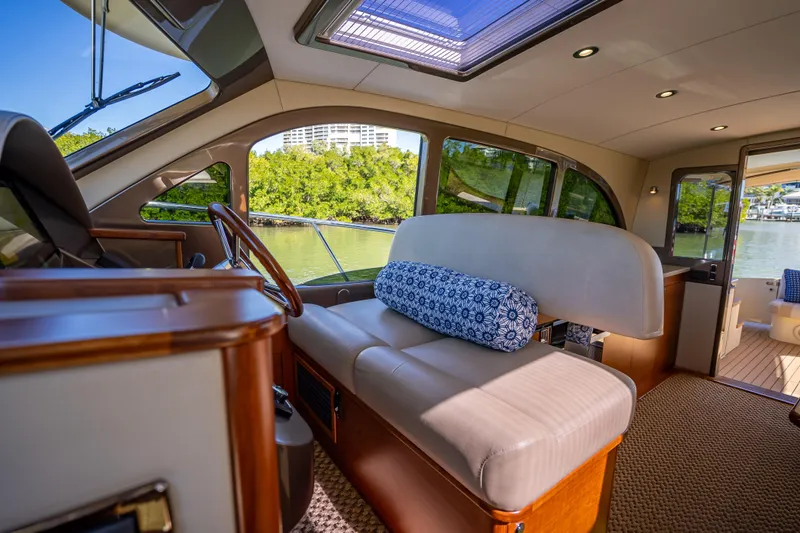 Miller Time Yacht Photos Pics Luxurious interior of 2017 Palm Beach Motor Yachts PB45, featuring elegant seating and scenic views.