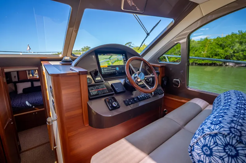 Miller Time Yacht Photos Pics 2017 Palm Beach Motor Yachts PB45 interior helm with navigation system and luxurious seating.