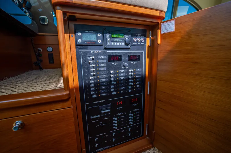 Miller Time Yacht Photos Pics Electrical control panel inside 2017 Palm Beach Motor Yachts PB45, featuring various switches and displays.