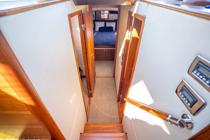 Miller Time Yacht Photos Pics Luxurious interior of 2017 Palm Beach Motor Yachts PB45, featuring elegant wood finishes.