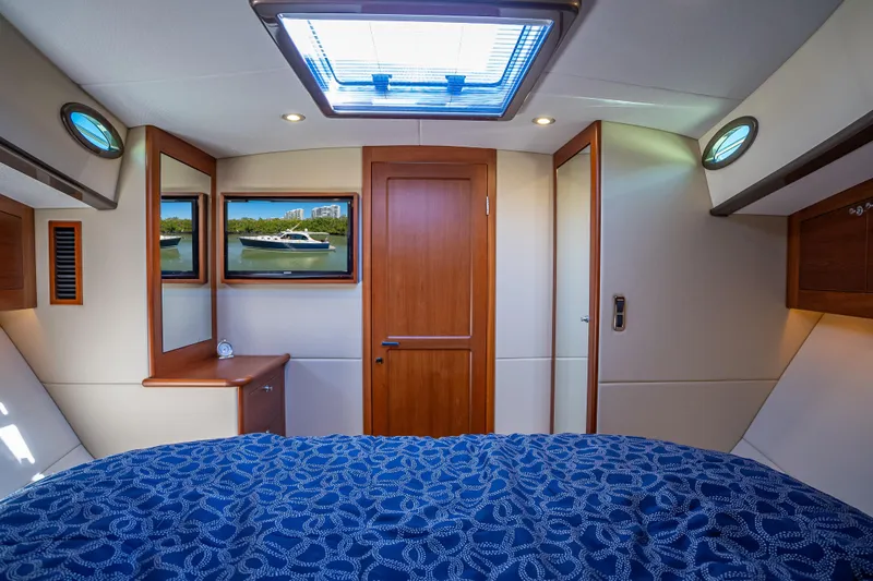 Miller Time Yacht Photos Pics Luxurious 2017 Palm Beach Motor Yachts PB45 cabin interior with elegant wood finishes.