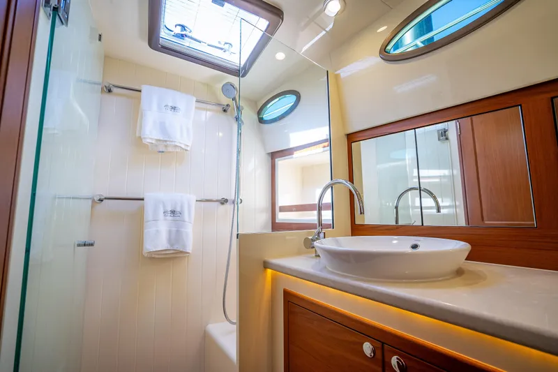 Miller Time Yacht Photos Pics Luxurious bathroom in 2017 Palm Beach Motor Yachts PB45, featuring elegant fixtures and modern design.