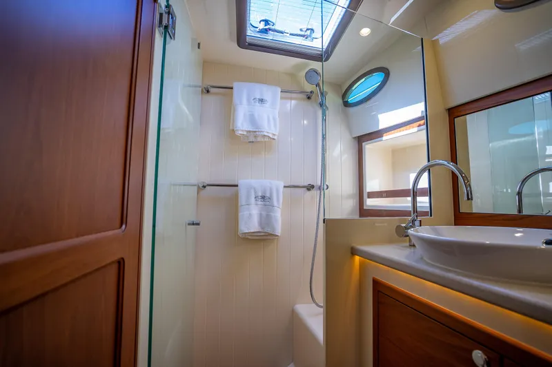 Miller Time Yacht Photos Pics Luxurious bathroom in 2017 Palm Beach Motor Yachts PB45, featuring modern fixtures and elegant design.