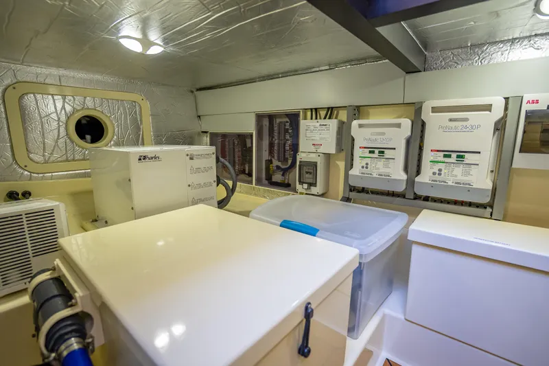 Miller Time Yacht Photos Pics Engine room of 2017 Palm Beach Motor Yachts PB45, featuring electrical systems and equipment.