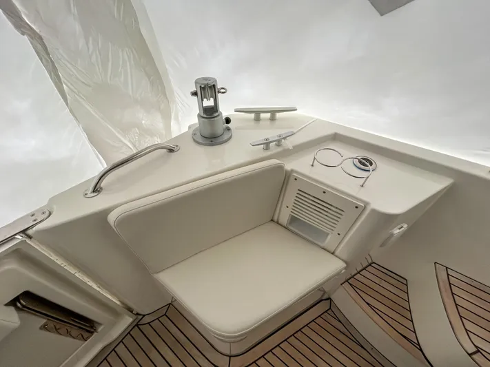  Yacht Photos Pics 2023 Beneteau Swift Trawler 35 deck with seating and teak flooring.